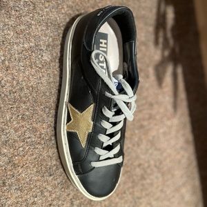 Barely worn black with gold hi star golden goose! Size 39.